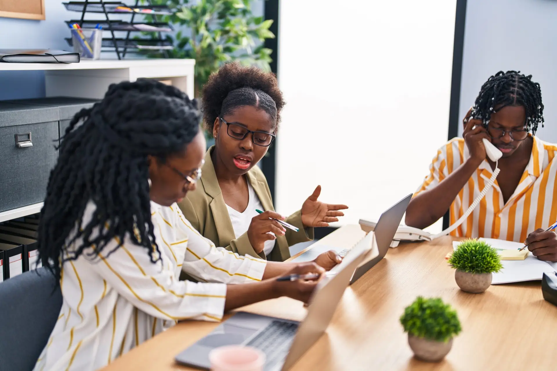african american friends business workers sitting table working office scaled